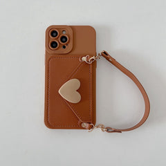 Front view of brown iPhone 15 case with strap