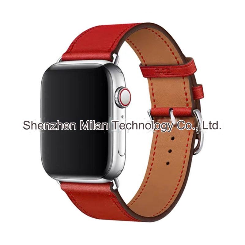 Model wearing Apple Watch with leather band