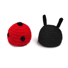 Close-up of beetle-themed crochet baby hat