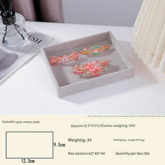 Stylish grey velvet jewelry tray with earrings
