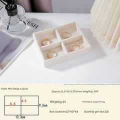 Beige velvet-lined jewelry storage for bracelets