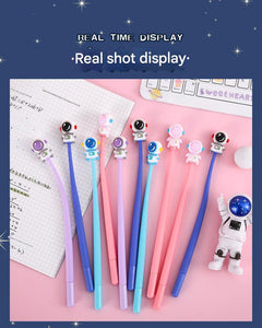 Set of astronaut-themed gel pens on a white background