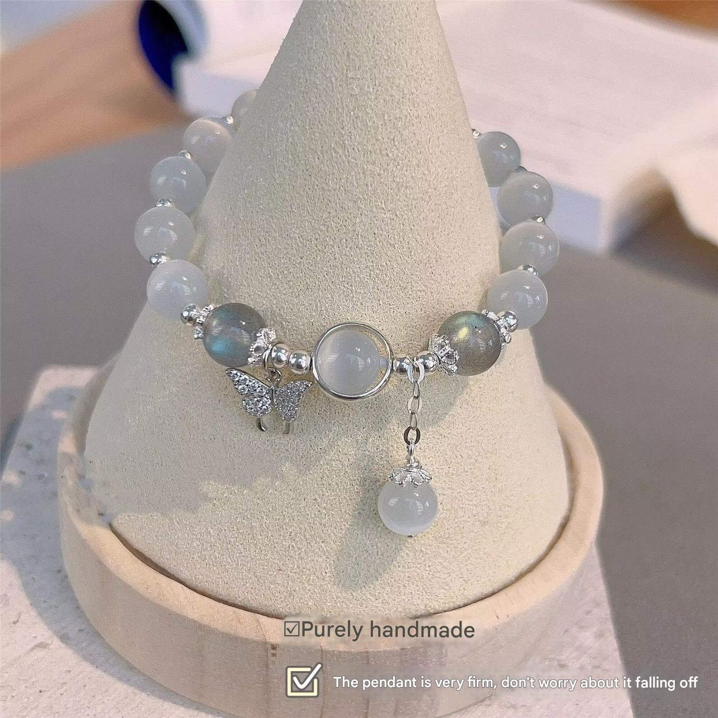 Adjustable butterfly bracelet on a model's wrist