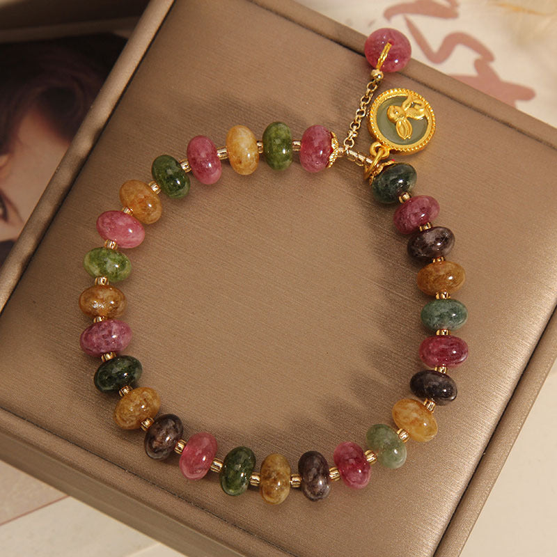 Gift-worthy tourmaline charm bracelet display