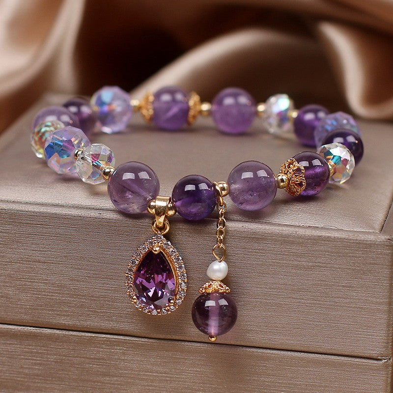 Close-up of heart pendant design on bracelet