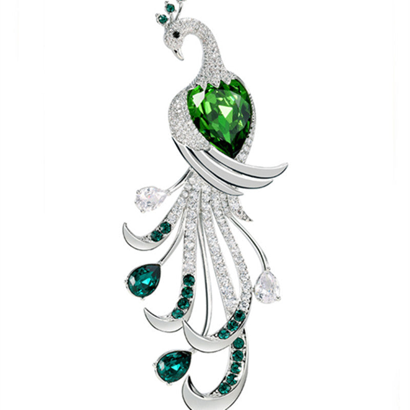 Close-up detail of green zircon stones on brooch
