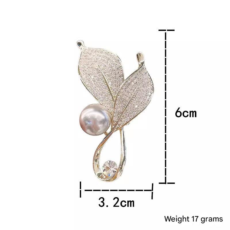 Elegant Leaf Brooch Displayed on a Clothing Item - Image 3