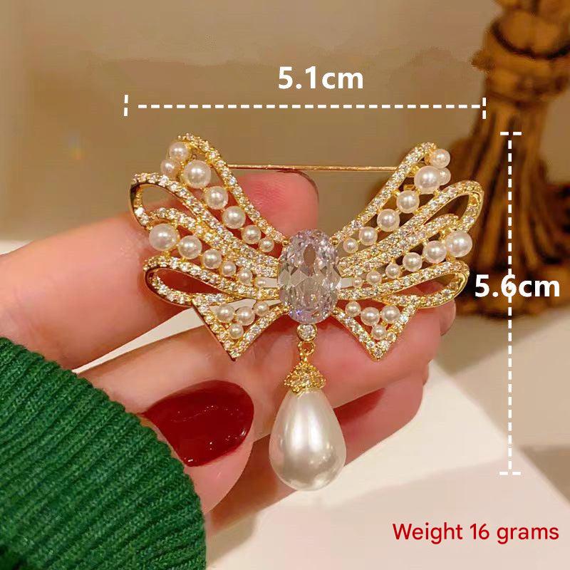 Elegant gold bow brooch on clothing