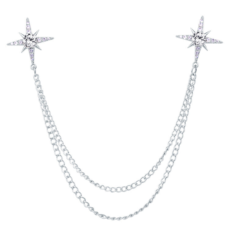 Two-tone gold star brooch featuring crystals