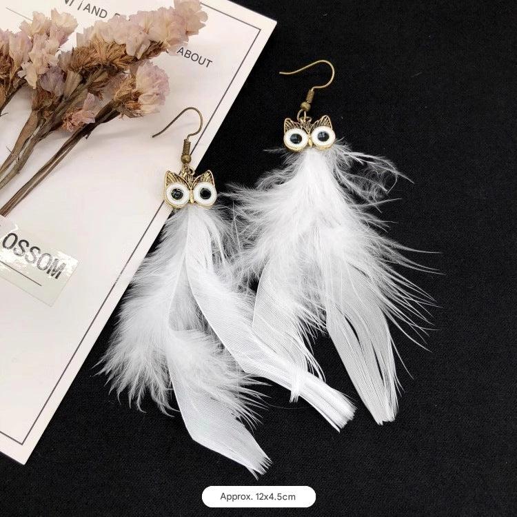 Detailed view of owl and peacock earrings image 10