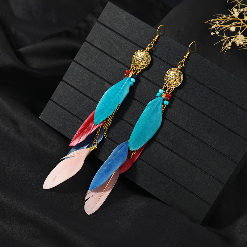 Bohemian feather tassel earrings in vibrant blue