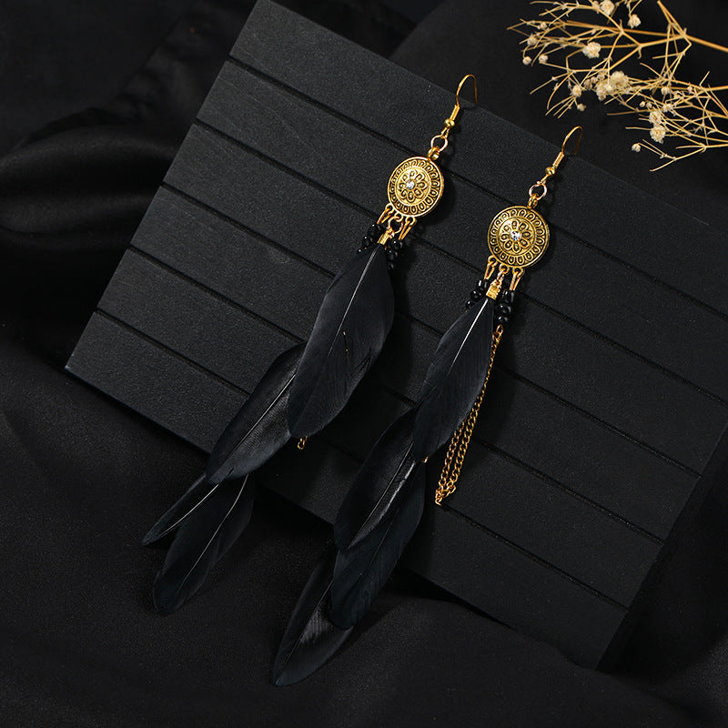 Handcrafted earrings with feather details