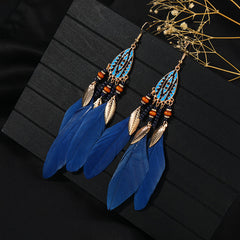 Handcrafted earrings with feather details