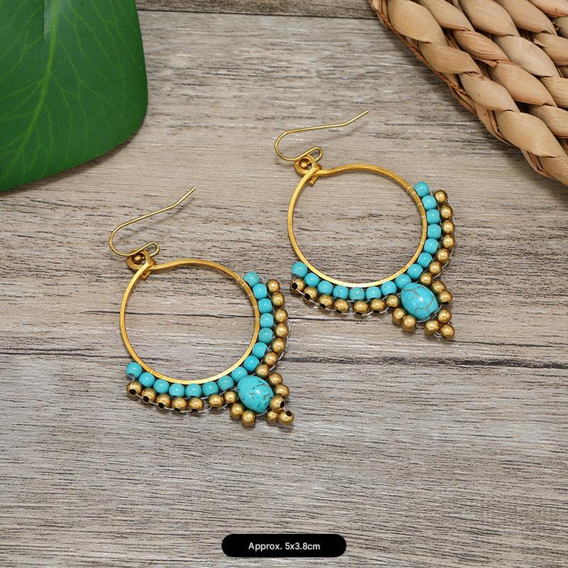 Close-up of elegant tassel earrings on a model