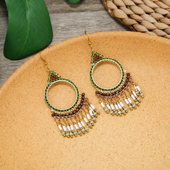Close-up of elegant tassel earrings on a model