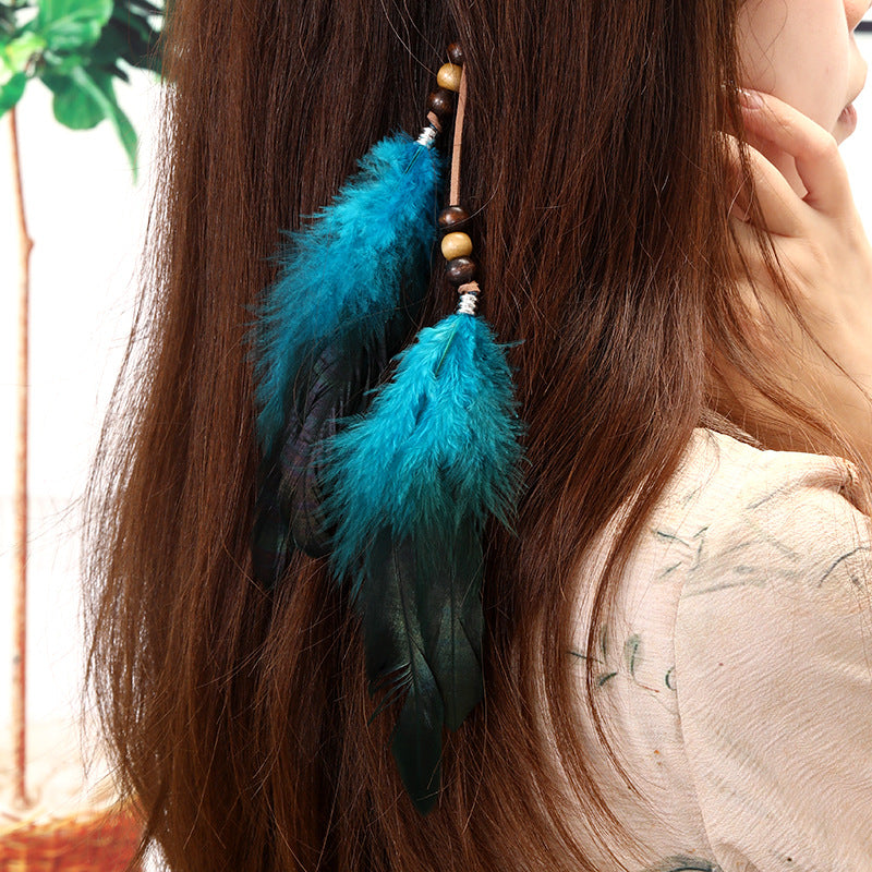 Side view of colourful feather hair clip