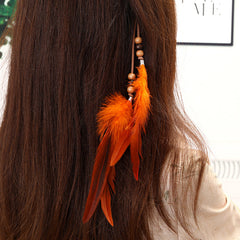 Vibrant bohemian hair clip with tassels close-up