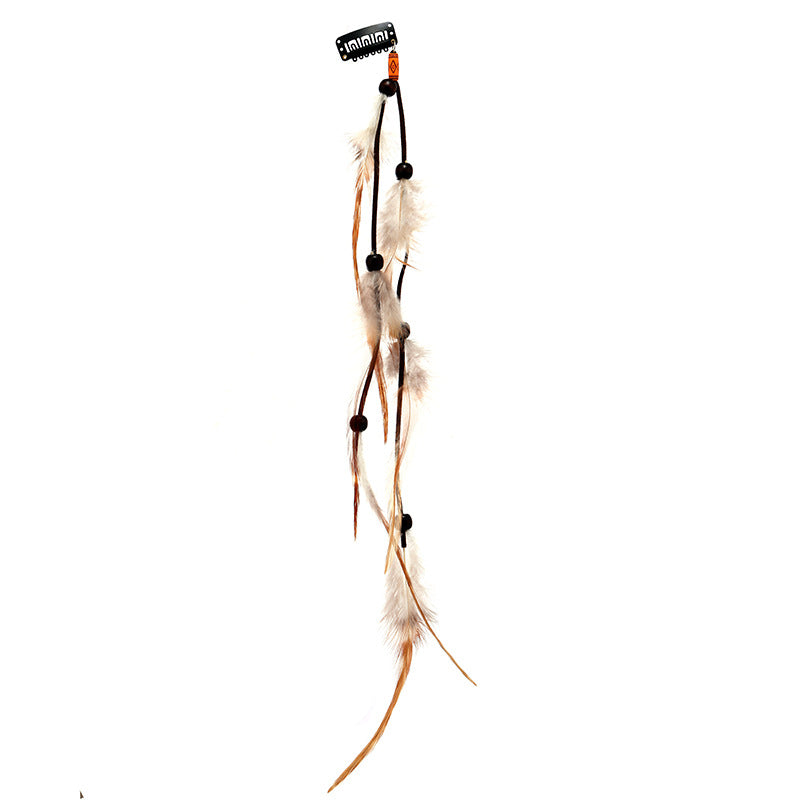 Vibrant bohemian hair clip with tassels close-up