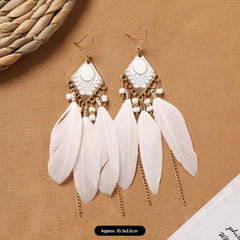 model wearing vintage style feather earrings