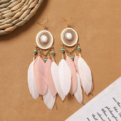 model wearing vintage style feather earrings