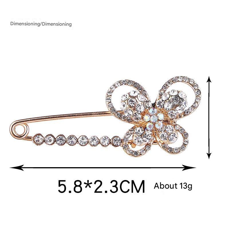 Close-up of Decorative Brooch with Pearl Detail - Image 2