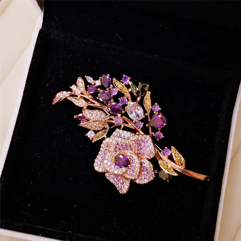 Close-up view of rhinestone details on floral brooch