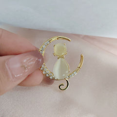 Stylish cat eye diamond brooch on display