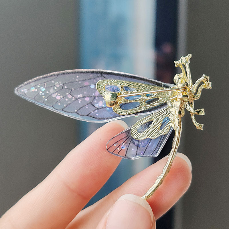 Vintage-inspired animal brooch displayed on patterned fabric
