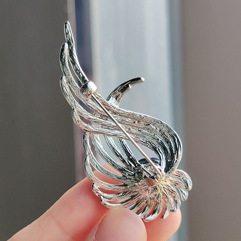 Unique women's accessory brooch displayed on fabric