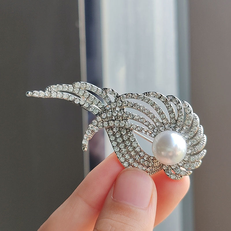Brooch on display highlighting its angel wing design