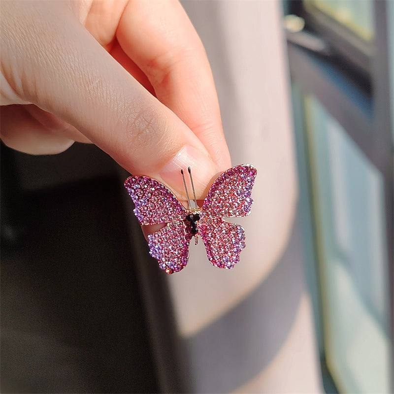 Butterfly brooch worn on a cardigan