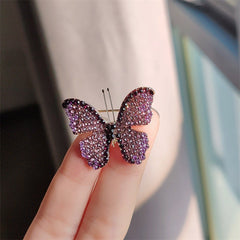Side view of butterfly brooch showing rhinestone details