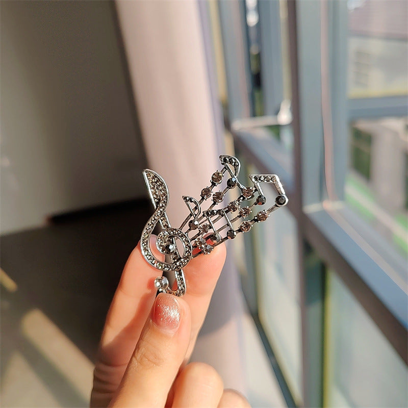 Elegant brooch displayed on fabric - image 10