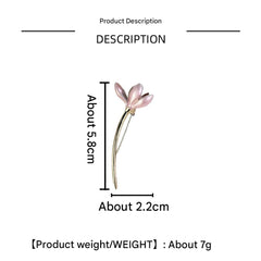 Vintage style flower brooch pin displayed on a stand