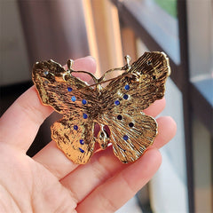 Elegant butterfly brooch on a coat