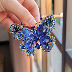 Elegant butterfly brooch on a scarf