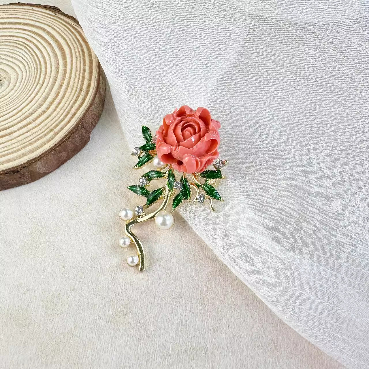 detailed view of peony brooch on model