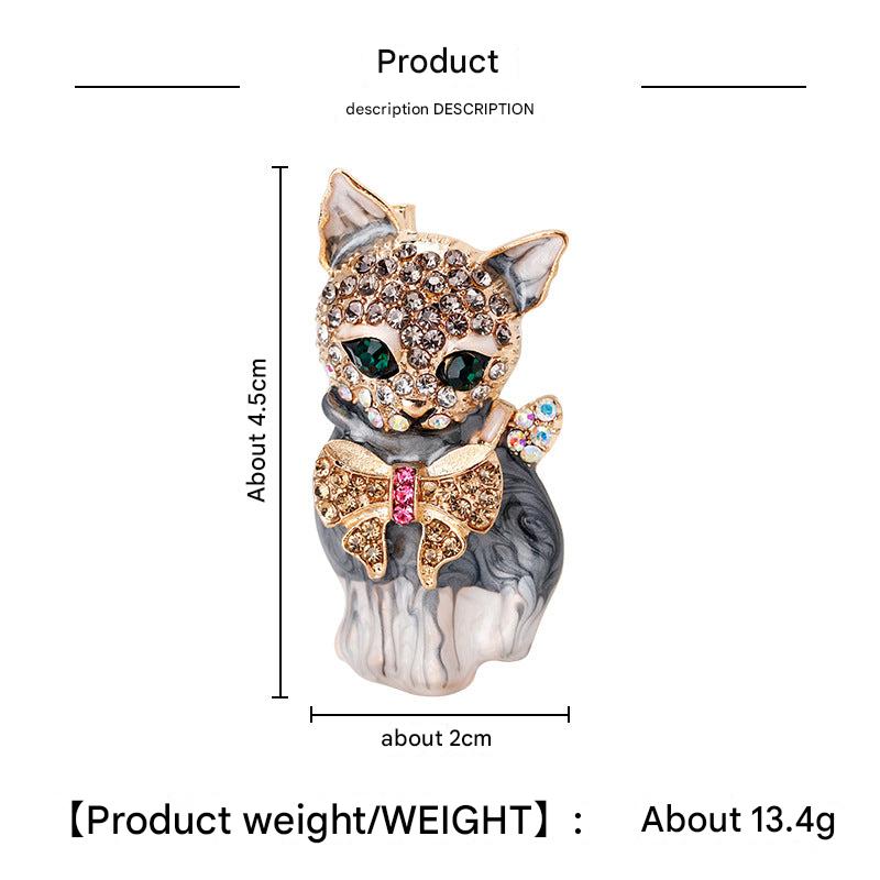 Detail view of unique cat brooch accessory
