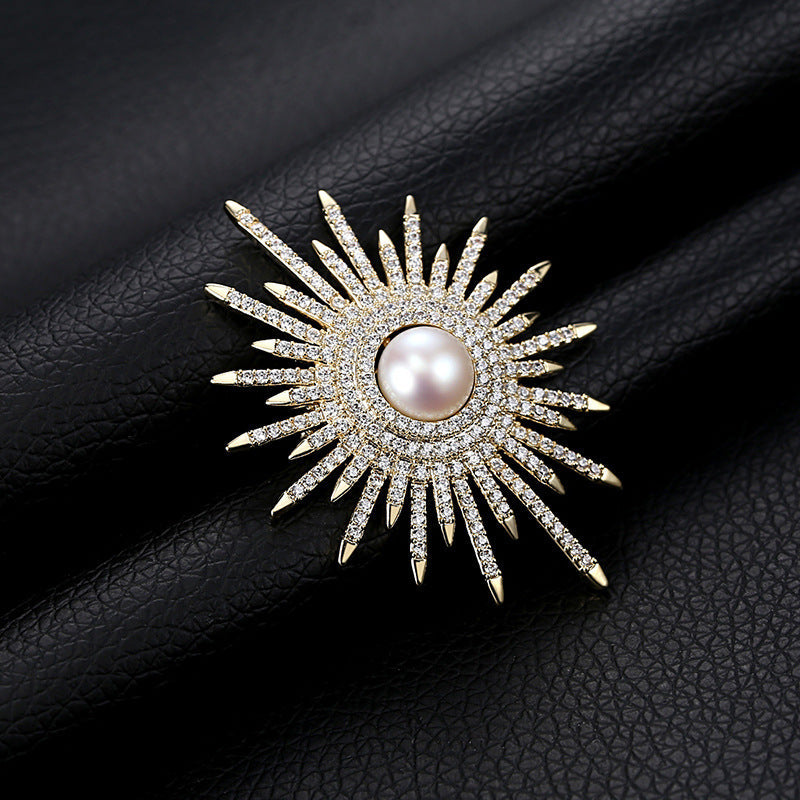 Brooch on a light-coloured sweater