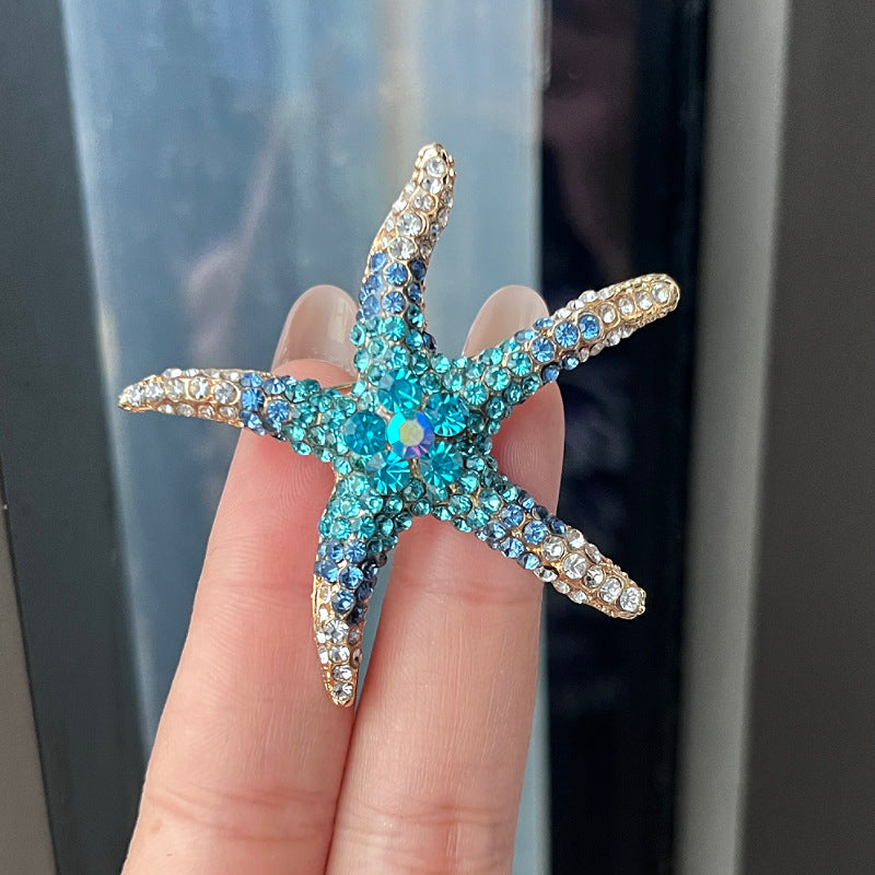 Close-up of rhinestone embellished starfish pin
