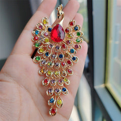 Retro peacock brooch featuring rhinestones