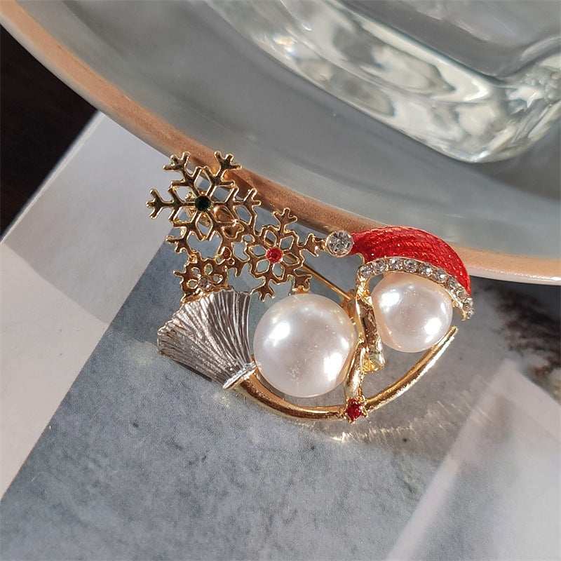 Side view of adorable snowman brooch with pearls