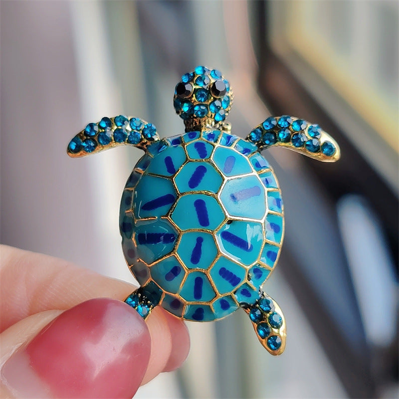 Colourful turtle pin brooch styled with outfits