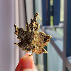Stylish vintage leaf brooch with vibrant crystals