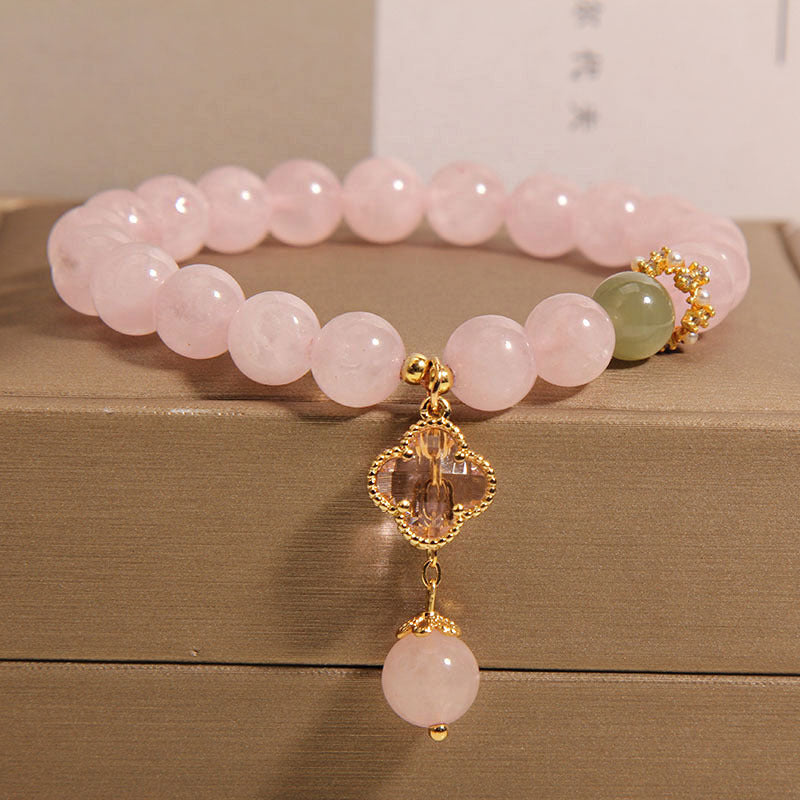Four leaf clover pendant on pink quartz bracelet