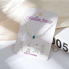 Beauty shot of gold jewelry set for women