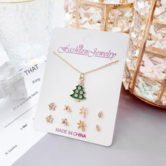 Playful moon and snowman themed earrings close-up