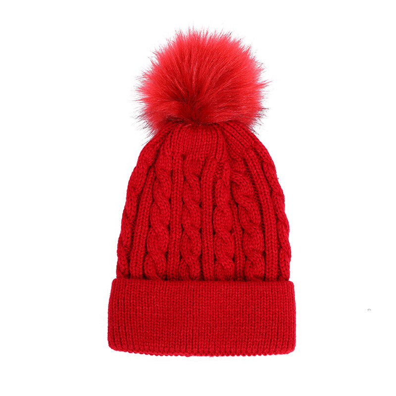 White knit beanie with stylish pom pom accent