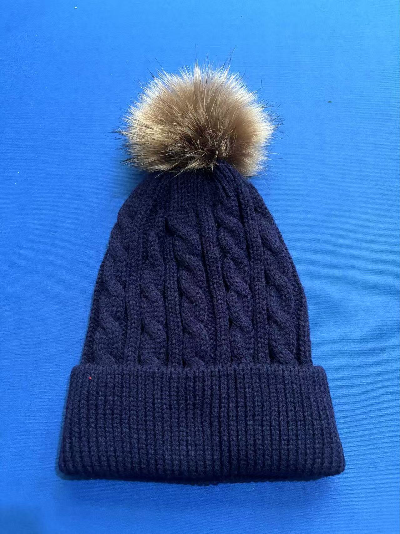 Light grey knit beanie hat with pom pom