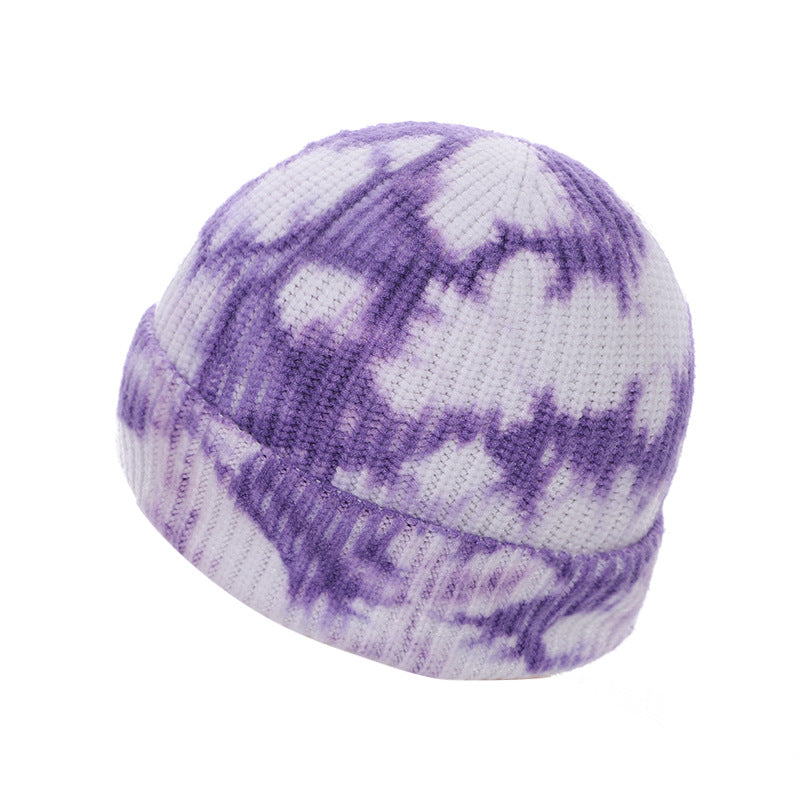 Close-up of violet knitted beanie outdoors
